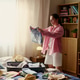 Adult Woman Packing Clothes for Vacation Travel at Home Adult Woman Packing Clothes for Vacation Travel at Home - PhotoDune Item for Sale