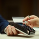 Woman Tapping Payment Card for Hotel Check in Transaction Woman Tapping Payment Card for Hotel Check in Transaction - PhotoDune Item for Sale