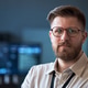 Portrait of Adult Man Wearing Glasses in Technology Workplace Portrait of Adult Man Wearing Glasses in Technology Workplace - PhotoDune Item for Sale