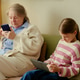 Senior Woman and Girl Using Digital Devices at Home for Family Leisure Senior Woman and Girl Using Digital Devices at Home for Family Leisure - PhotoDune Item for Sale