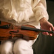 Woman Holding Violin for Music Lesson or Classical Education Woman Holding Violin for Music Lesson or Classical Education - PhotoDune Item for Sale