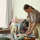 Woman Packing Luggage for Family Hotel Vacation Stay Woman Packing Luggage for Family Hotel Vacation Stay - PhotoDune Item for Sale
