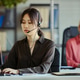 Asian Adult Woman Managing Customer Support Tasks in Team Office Asian Adult Woman Managing Customer Support Tasks in Team Office - PhotoDune Item for Sale