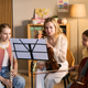 Schoolgirls Studying Music with Teacher during Instrument Lesson Schoolgirls Studying Music with Teacher during Instrument Lesson - PhotoDune Item for Sale