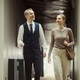 Porter Assisting Female Guest with Luggage in Hotel Corridor Porter Assisting Female Guest with Luggage in Hotel Corridor - PhotoDune Item for Sale