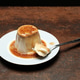 Panna Cotta on a White Plate With Caramel Sauce and a Spoon Panna Cotta on a White Plate With Caramel Sauce and a Spoon - PhotoDune Item for Sale