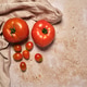 Fresh Tomatoes Are Placed on a Light Surface Beside a Cloth Fresh Tomatoes Are Placed on a Light Surface Beside a Cloth - PhotoDune Item for Sale