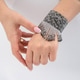 Elegant beaded bracelet on female hand with french manicure Elegant beaded bracelet on female hand with french manicure - PhotoDune Item for Sale