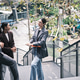 Three businesspeople are discussing jobs at outdoor communication workplace. Three businesspeople are discussing jobs at outdoor communication workplace. - PhotoDune Item for Sale