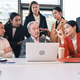 The business people team watches stock investment results on laptop together. The business people team watches stock investment results on laptop together. - PhotoDune Item for Sale