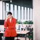 Hispanic businesswoman standing and pensive thinking in modern workplace. Hispanic businesswoman standing and pensive thinking in modern workplace. - PhotoDune Item for Sale