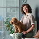 Portrait of Adult Woman Sitting with Dog in Veterinary Waiting Room Portrait of Adult Woman Sitting with Dog in Veterinary Waiting Room - PhotoDune Item for Sale