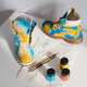 Tie dye boots with brush and paint on white table. Handcrafted footwear customization Tie dye boots with brush and paint on white table. Handcrafted footwear customization - PhotoDune Item for Sale