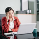 Asian woman taking off glasses and touching bridge of nose at desk. Concept of burnout, eye strain, Asian woman taking off glasses and touching bridge of nose at desk. Concept of burnout, eye strain, - PhotoDune Item for Sale