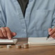 Cropped hands using calculator and writing in notebook for tax planning Cropped hands using calculator and writing in notebook for tax planning - PhotoDune Item for Sale