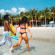 Romantic young couple enjoying their tropical honeymoon on a beautiful sunny beach Romantic young couple enjoying their tropical honeymoon on a beautiful sunny beach - PhotoDune Item for Sale