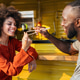Happy black couple traveling and enjoying exotic street food with chopsticks, having fun Happy black couple traveling and enjoying exotic street food with chopsticks, having fun - PhotoDune Item for Sale