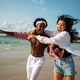 Stylish young multiethnic people in trendy summer outfits enjoying a sunny day at a beach resort Stylish young multiethnic people in trendy summer outfits enjoying a sunny day at a beach resort - PhotoDune Item for Sale