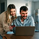 Smiling couple using credit card and laptop at home, representing fintech innovation digital finance Smiling couple using credit card and laptop at home, representing fintech innovation digital finance - PhotoDune Item for Sale