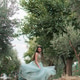 Teenage girl twirling formal gown in garden path during celebration vertical Teenage girl twirling formal gown in garden path during celebration vertical - PhotoDune Item for Sale
