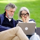 Senior couple feeling shocked and worried using laptop outdoors Senior couple feeling shocked and worried using laptop outdoors - PhotoDune Item for Sale