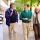 Group of senior friends walking and conversing outdoors Group of senior friends walking and conversing outdoors - PhotoDune Item for Sale