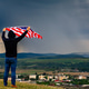 Man holding a waving american USA flag. Man holding a waving american USA flag. - PhotoDune Item for Sale