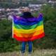 Non-binary person waving LGTB flag in the meadow. LGBT pride concept. Non-binary person waving LGTB flag in the meadow. LGBT pride concept. - PhotoDune Item for Sale