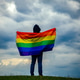 Non-binary person waving LGTB flag in the meadow. LGBT pride concept. Non-binary person waving LGTB flag in the meadow. LGBT pride concept. - PhotoDune Item for Sale