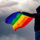 Non-binary person waving LGTB flag in the meadow. LGBT pride concept. Non-binary person waving LGTB flag in the meadow. LGBT pride concept. - PhotoDune Item for Sale