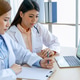 Two asian women doctors discuss meeting doctor's office medical clinic using laptop consulting patie Two asian women doctors discuss meeting doctor's office medical clinic using laptop consulting patie - PhotoDune Item for Sale
