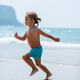 Toddler Running On Sandy Beach Toddler Running On Sandy Beach - PhotoDune Item for Sale