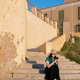 Woman with vitiligo sitting on stone stairs using smartphone Woman with vitiligo sitting on stone stairs using smartphone - PhotoDune Item for Sale