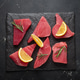 Raw tuna fish steaks fillet rosemary lemon black slate background healthy Raw tuna fish steaks fillet rosemary lemon black slate background healthy - PhotoDune Item for Sale