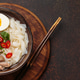 Asian soup rice noodles duck meat egg chopsticks ramen bowl dark rustic background copy space Asian soup rice noodles duck meat egg chopsticks ramen bowl dark rustic background copy space - PhotoDune Item for Sale