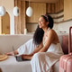 Happy black woman using laptop while making a reservation for summer holiday. Happy black woman using laptop while making a reservation for summer holiday. - PhotoDune Item for Sale