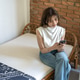 Asian Woman Using Smartphone While Sitting on Sofa at Home Asian Woman Using Smartphone While Sitting on Sofa at Home - PhotoDune Item for Sale