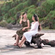 Young Asian Women Relaxing on Driftwood at Parangtritis Beach Yogyakarta Young Asian Women Relaxing on Driftwood at Parangtritis Beach Yogyakarta - PhotoDune Item for Sale