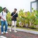 Two Asian Indonesian Men Walking and Talking on Campus Path Two Asian Indonesian Men Walking and Talking on Campus Path - PhotoDune Item for Sale