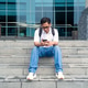 Asian Indonesian Man Using Smartphone Sitting on Urban Building Steps Asian Indonesian Man Using Smartphone Sitting on Urban Building Steps - PhotoDune Item for Sale