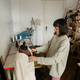 Seamstress adjusting a garment on a mannequin in her cozy home sewing studio Seamstress adjusting a garment on a mannequin in her cozy home sewing studio - PhotoDune Item for Sale