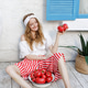 Woman Holding Ripe Tomatoes with Bowl on Wooden Deck Woman Holding Ripe Tomatoes with Bowl on Wooden Deck - PhotoDune Item for Sale