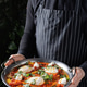 Delicious Shakshuka with Poached Eggs and Fresh Herbs Served in a Pan Delicious Shakshuka with Poached Eggs and Fresh Herbs Served in a Pan - PhotoDune Item for Sale