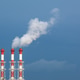 Red and white industrial chimneys release soft steam into calm blue sky Red and white industrial chimneys release soft steam into calm blue sky - PhotoDune Item for Sale