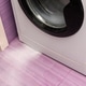 Water leaks from washing machine across pink tiled floor Water leaks from washing machine across pink tiled floor - PhotoDune Item for Sale