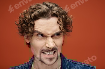 Handsome Emotional Man Expressing Feelings Against a Vibrant Orange Backdrop 2 E11D2QN.jpg?w=350&h=350&cf fit=scale down&mark=https%3A%2F%2Fassets.market storefront.envato static.com%2Fwatermarks%2Fphoto 260724