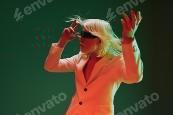 Stylish performer with long white hair, wearing a blindfold, posing dramatically in an artistic 2 E117QG0J.jpg?w=350&h=350&cf fit=scale down&mark=https%3A%2F%2Fassets.market storefront.envato static.com%2Fwatermarks%2Fphoto 260724