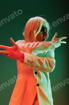 Futuristic performer with sleek white attire against a gradient green background, expressing dynamic 2 E117L3JX.jpg?w=350&h=350&cf fit=scale down&mark=https%3A%2F%2Fassets.market storefront.envato static.com%2Fwatermarks%2Fphoto 260724