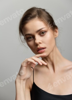Thoughtful young woman with elegant hairstyle and subtle makeup, striking a pose against a soft gray 2 E117O69P.jpg?w=350&h=350&cf fit=scale down&mark=https%3A%2F%2Fassets.market storefront.envato static.com%2Fwatermarks%2Fphoto 260724