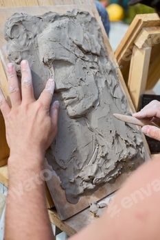 Creating clay relief portrait with wooden tools 2 E1181C1S.jpg?w=350&h=350&cf fit=scale down&mark=https%3A%2F%2Fassets.market storefront.envato static.com%2Fwatermarks%2Fphoto 260724
